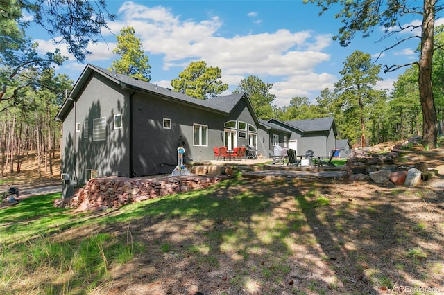 rear view of property with a patio area