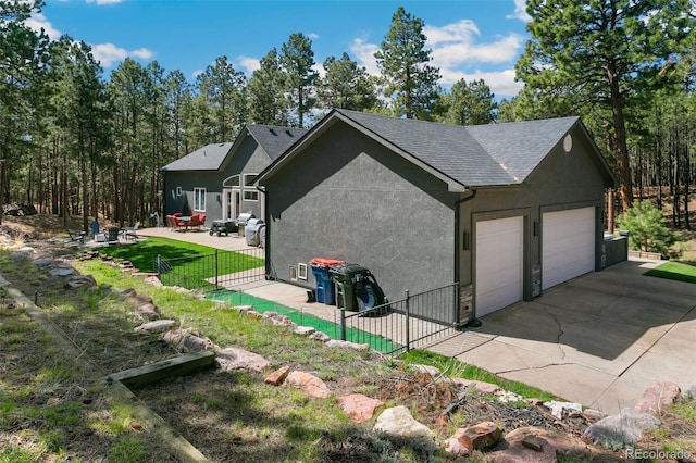 view of side of property featuring a garage