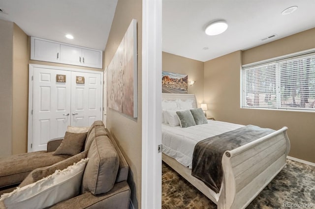 carpeted bedroom with a closet