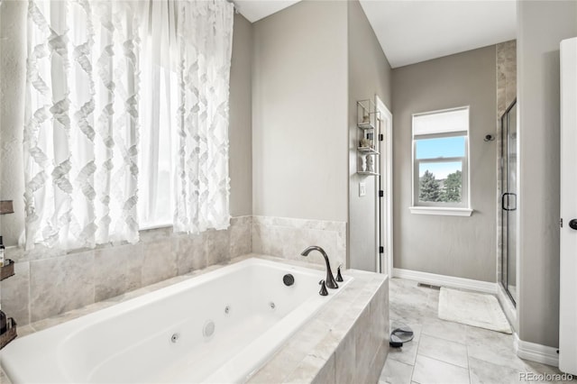 bathroom featuring independent shower and bath and tile patterned floors