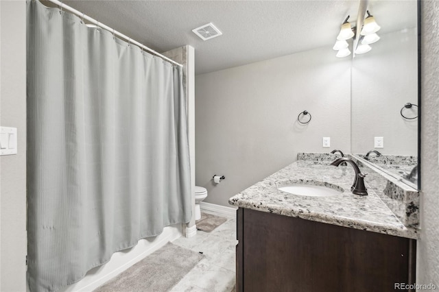 bathroom featuring vanity, toilet, a shower with curtain, and a textured ceiling