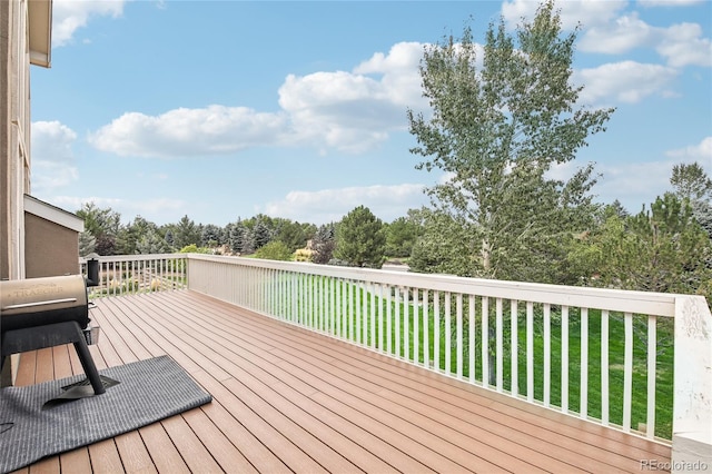 wooden deck with a yard