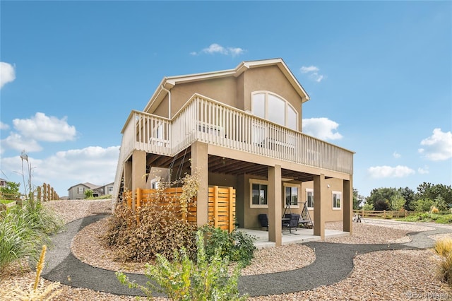 rear view of house featuring a patio