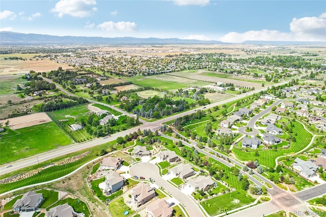 birds eye view of property featuring a mountain view