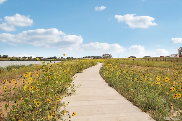 surrounding community with a water view