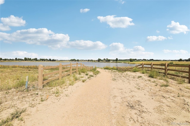 view of yard featuring a water view and a rural view