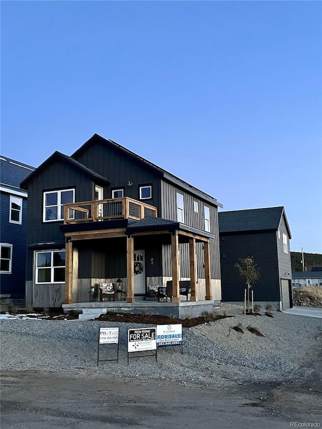 view of front of home with a balcony