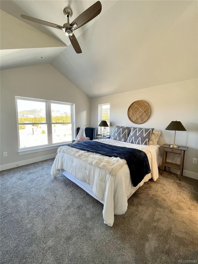 bedroom featuring ceiling fan, dark carpet, and vaulted ceiling