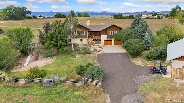 aerial view featuring a mountain view and a rural view