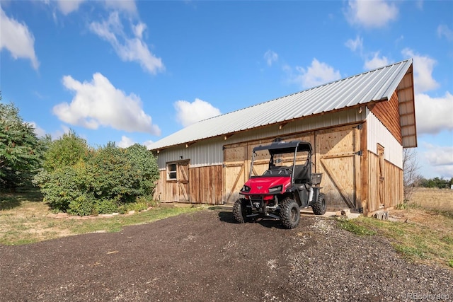 view of home's exterior featuring an outdoor structure