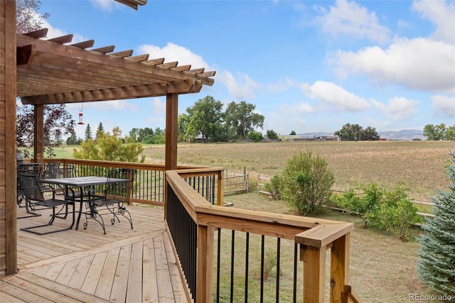 wooden terrace with a rural view and a pergola