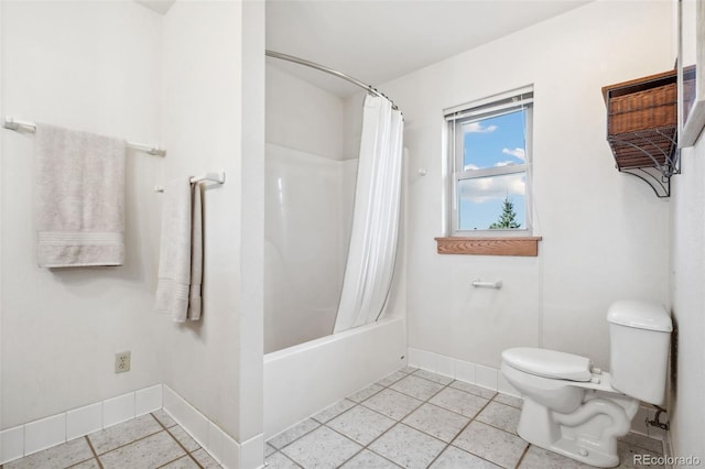 bathroom with tile patterned floors, shower / tub combo, and toilet