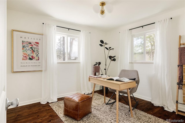 office space featuring baseboards and dark wood-style flooring