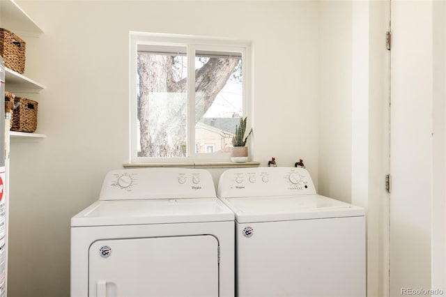 clothes washing area with laundry area and washer and clothes dryer
