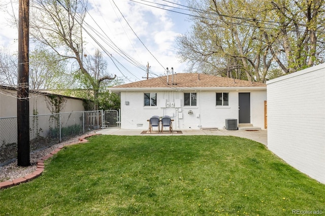 back of property featuring a gate, central AC, fence, a yard, and a patio