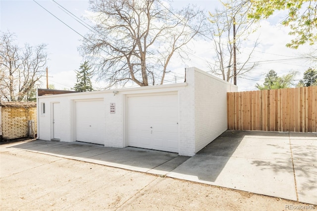 detached garage with fence