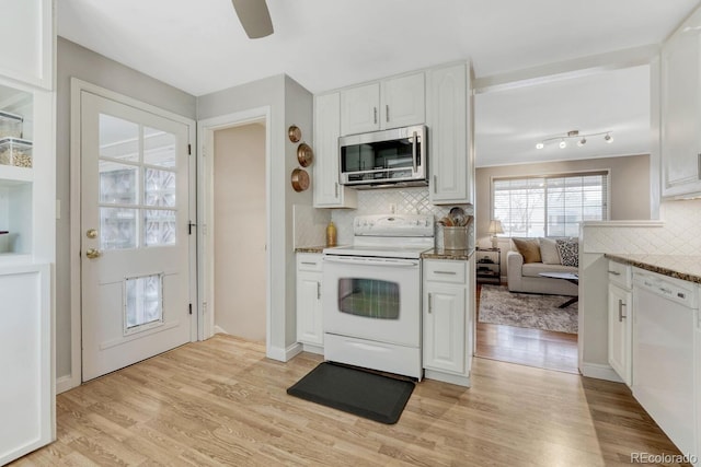 kitchen featuring light wood-style flooring, white appliances, a ceiling fan, white cabinets, and tasteful backsplash