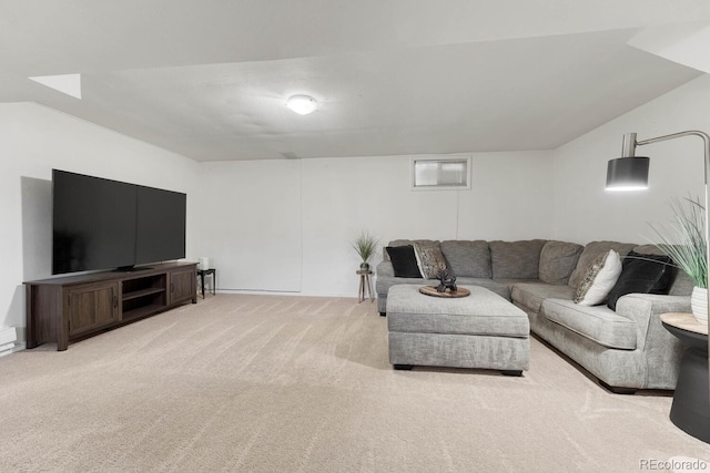 living room with light carpet and vaulted ceiling