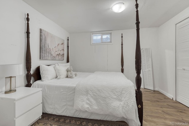 bedroom with light wood finished floors