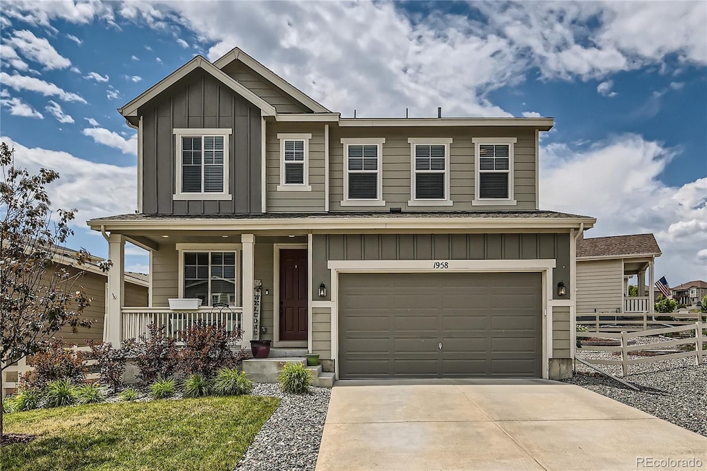 view of front of house featuring a garage and a porch