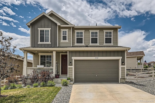 view of front of house featuring a garage and a porch