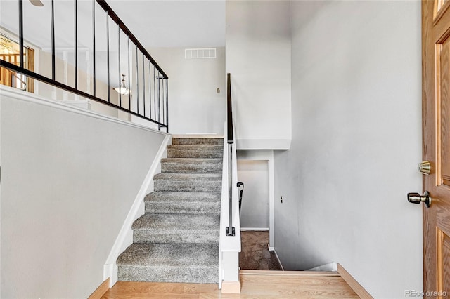 stairway with wood-type flooring