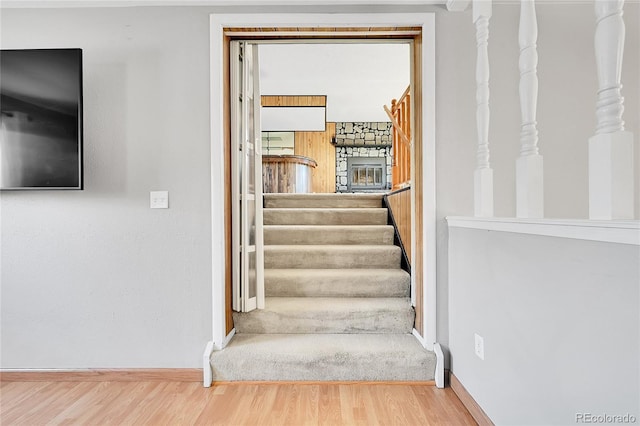 staircase with wood-type flooring