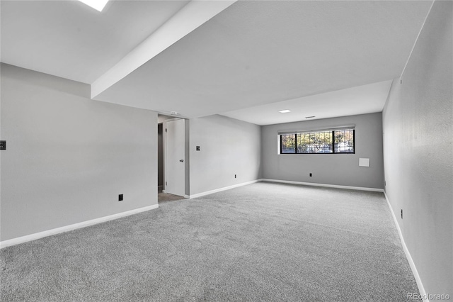 spare room featuring light colored carpet