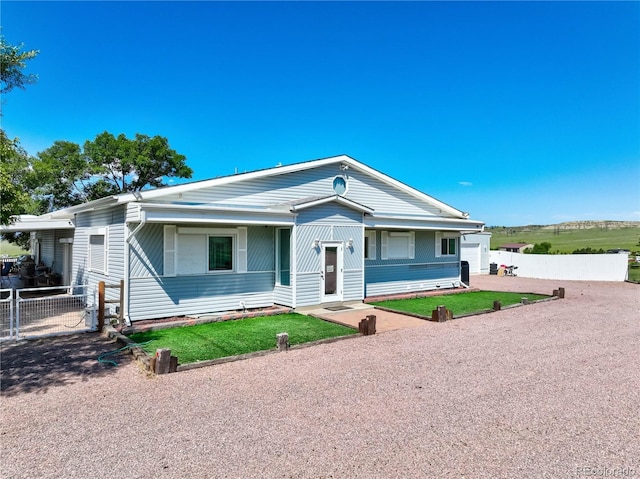 view of front of home featuring a front lawn