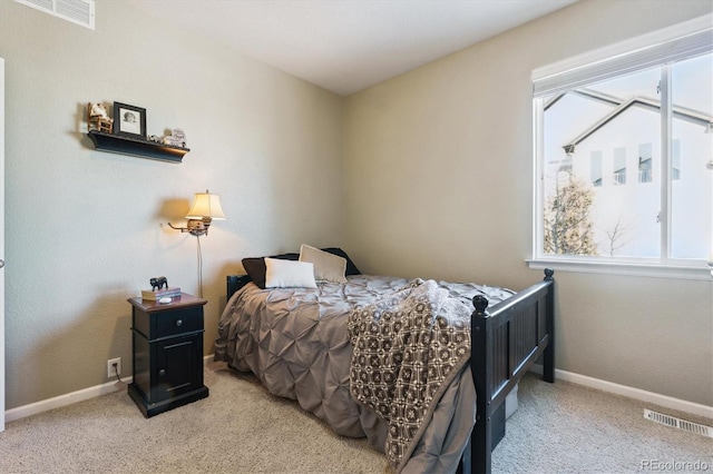 bedroom with light colored carpet