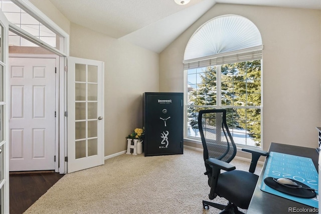 office featuring french doors, plenty of natural light, and lofted ceiling