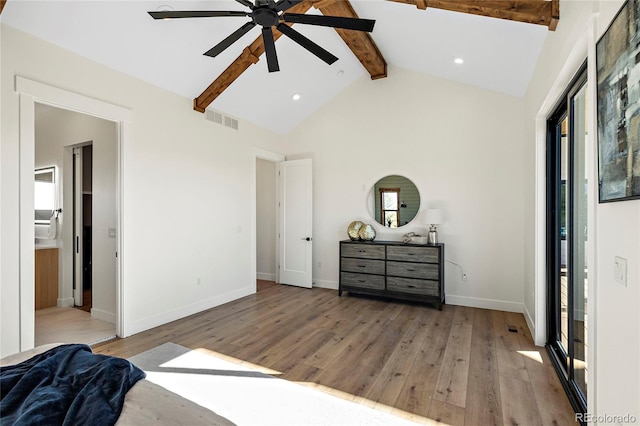 bedroom featuring ensuite bath, ceiling fan, hardwood / wood-style floors, and lofted ceiling with beams