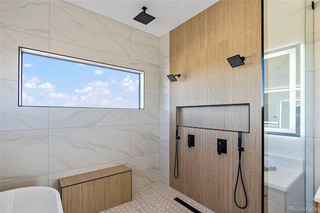 bathroom featuring tile patterned flooring, separate shower and tub, and tile walls