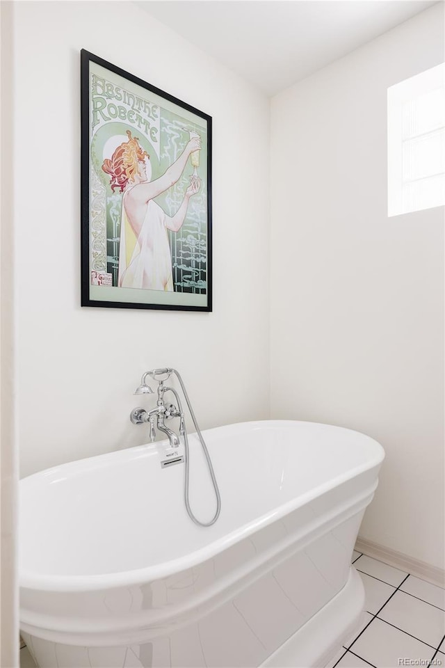 1010 N Jasmine St, Denver, CO 80220 - bathroom featuring a freestanding bath and tile patterned floors