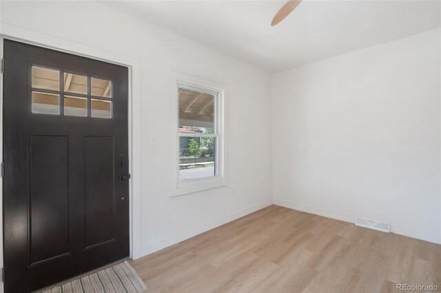 4636 Leaf Ct, Denver, CO 80216 - foyer with light wood-style flooring, baseboards, and ceiling fan