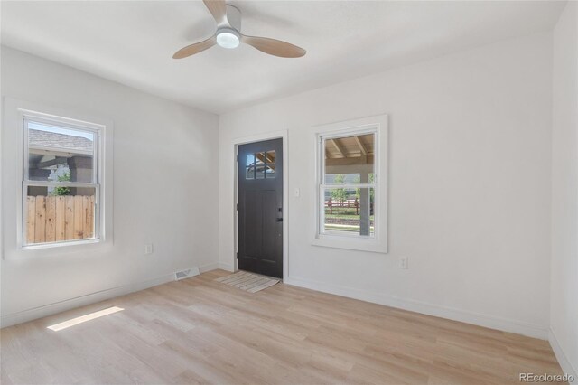 4636 Leaf Ct, Denver, CO 80216 - entrance foyer with light wood-type flooring, a ceiling fan, and baseboards