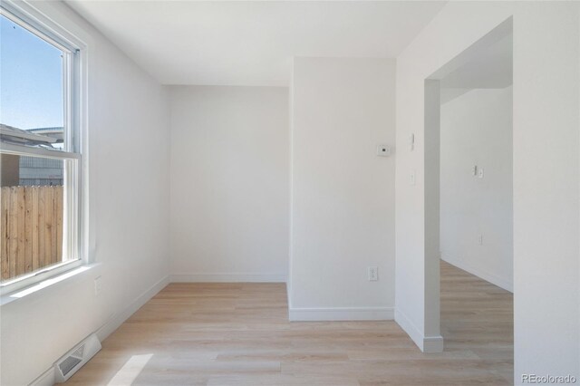 4636 Leaf Ct, Denver, CO 80216 - spare room featuring plenty of natural light, wood finished floors, and baseboards