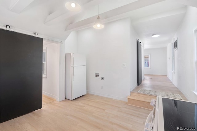 4636 Leaf Ct, Denver, CO 80216 - kitchen with freestanding refrigerator, a barn door, light wood-style floors, range with electric cooktop, and baseboards