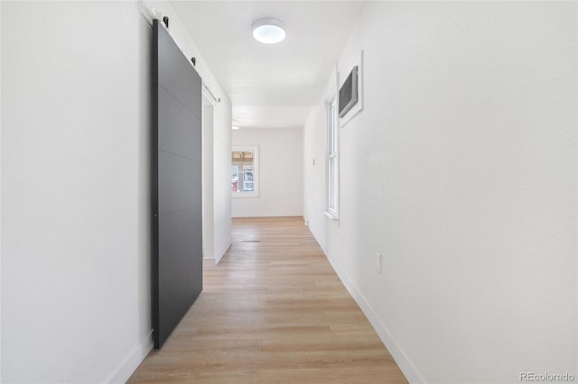 4636 Leaf Ct, Denver, CO 80216 - corridor with baseboards and light wood-style flooring