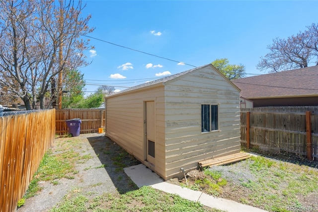 4636 Leaf Ct, Denver, CO 80216 - view of outdoor structure with a fenced backyard and an outbuilding