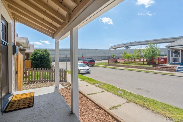 4636 Leaf Ct, Denver, CO 80216 - view of asphalt road featuring sidewalks and curbs