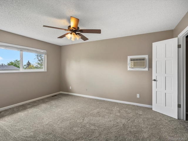 1642 S Salida Way, Aurora, CO 80017 - carpeted empty room featuring a wall mounted air conditioner, ceiling fan, a textured ceiling, and baseboards