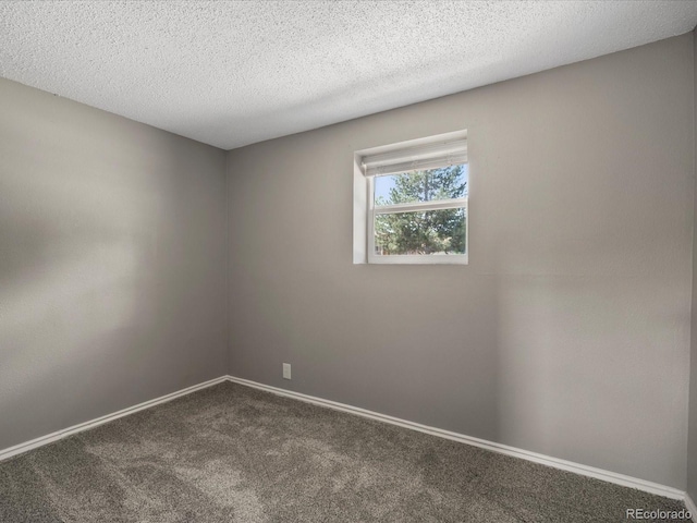 1642 S Salida Way, Aurora, CO 80017 - unfurnished room featuring dark carpet, baseboards, and a textured ceiling