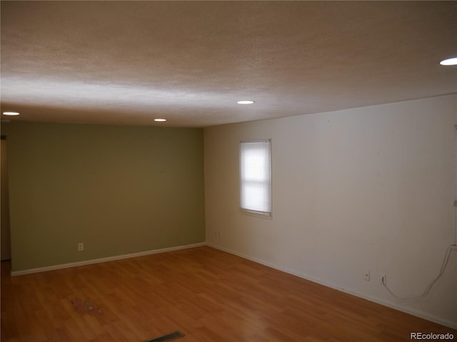 empty room featuring hardwood / wood-style floors