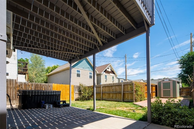 view of patio with a shed