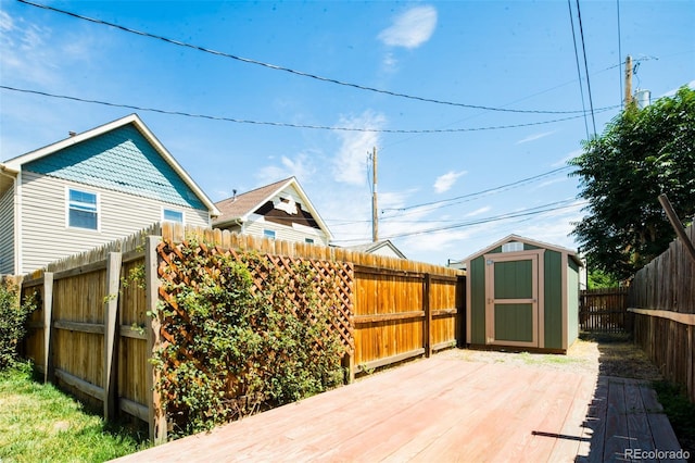 wooden deck featuring a storage shed