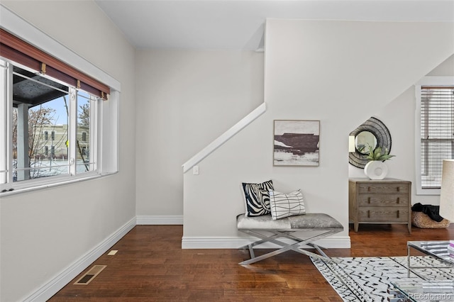 sitting room featuring dark wood-type flooring