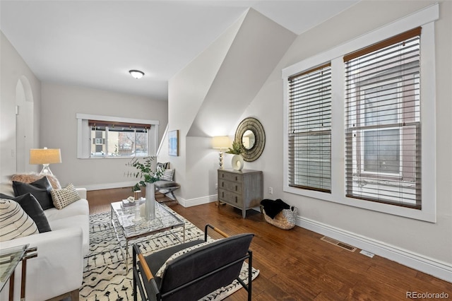 living room with dark hardwood / wood-style flooring