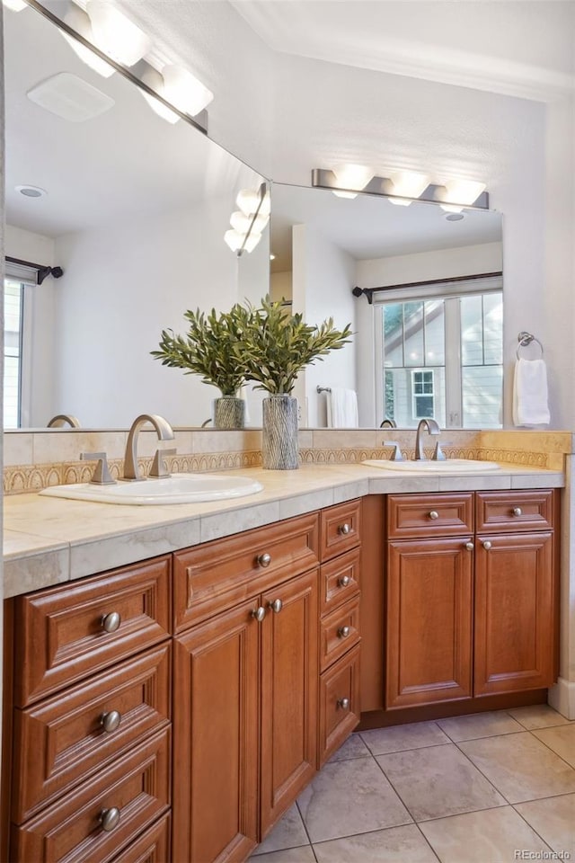 bathroom featuring tile patterned flooring and vanity