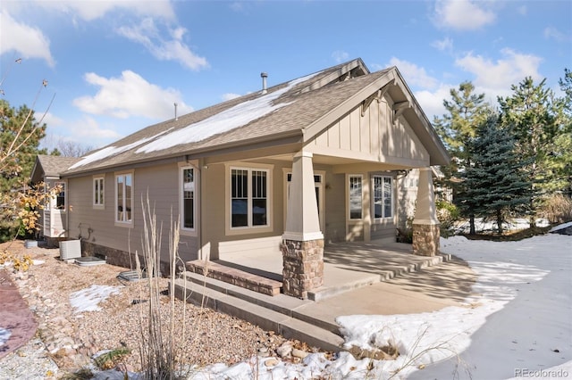 view of front of home featuring covered porch and central air condition unit